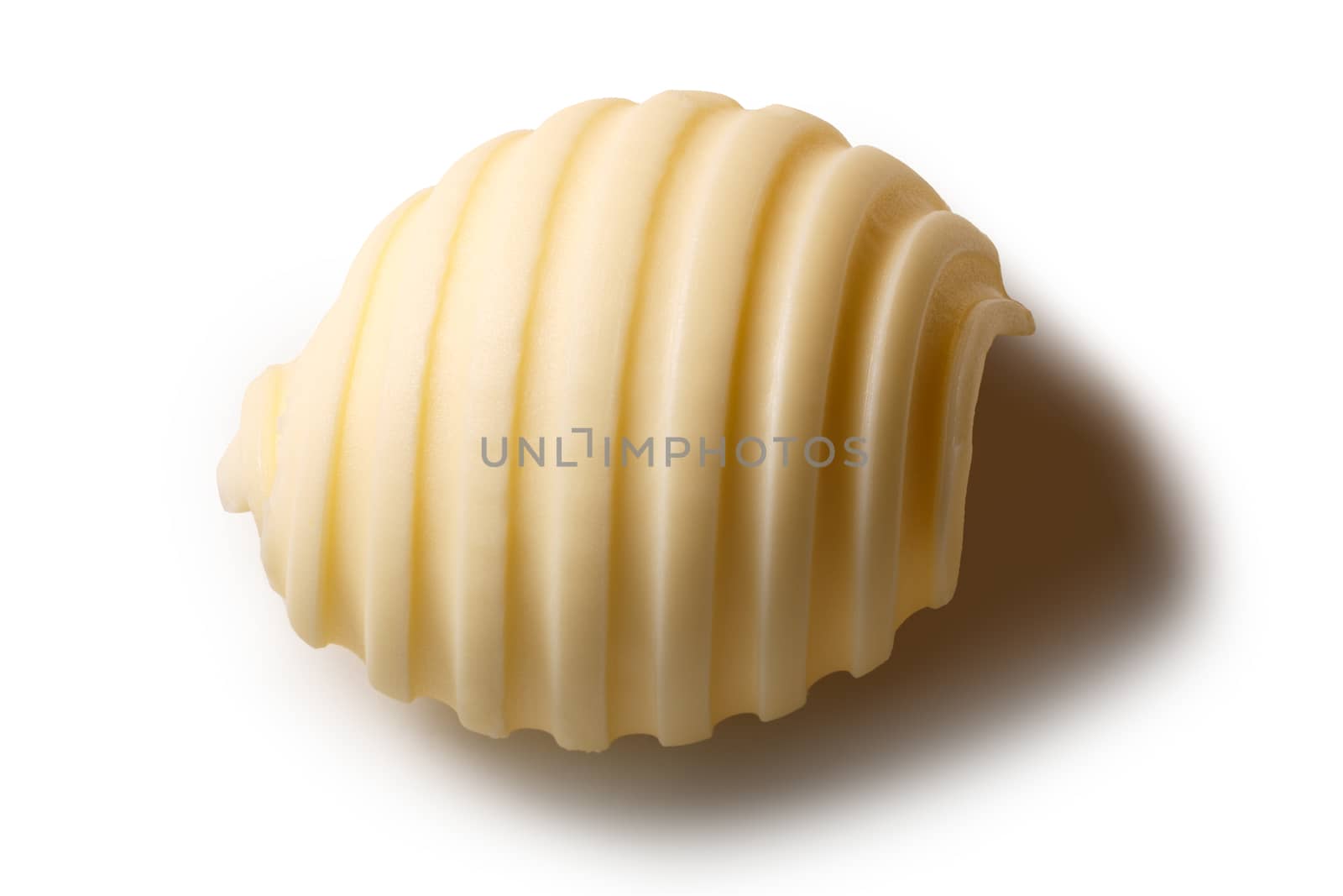 Butter curl or roll, above view. Clipping paths, shadow separated
