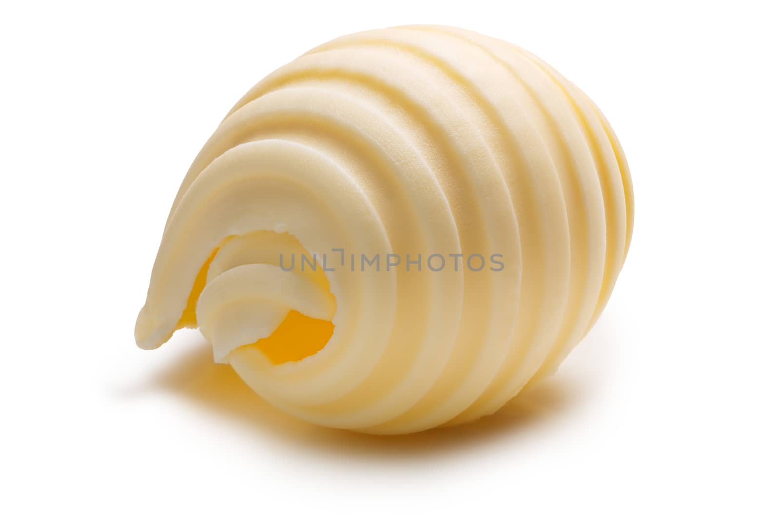 Butter curl or roll. Clipping paths, shadow separated
