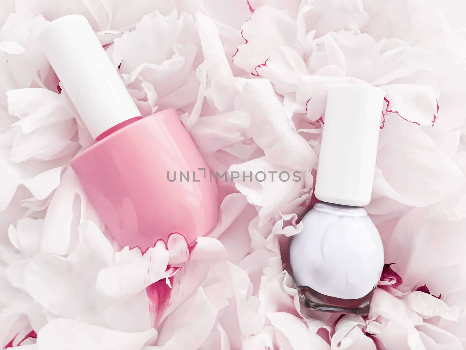 Nail polish bottles on floral background, french manicure and cosmetic branding by Anneleven