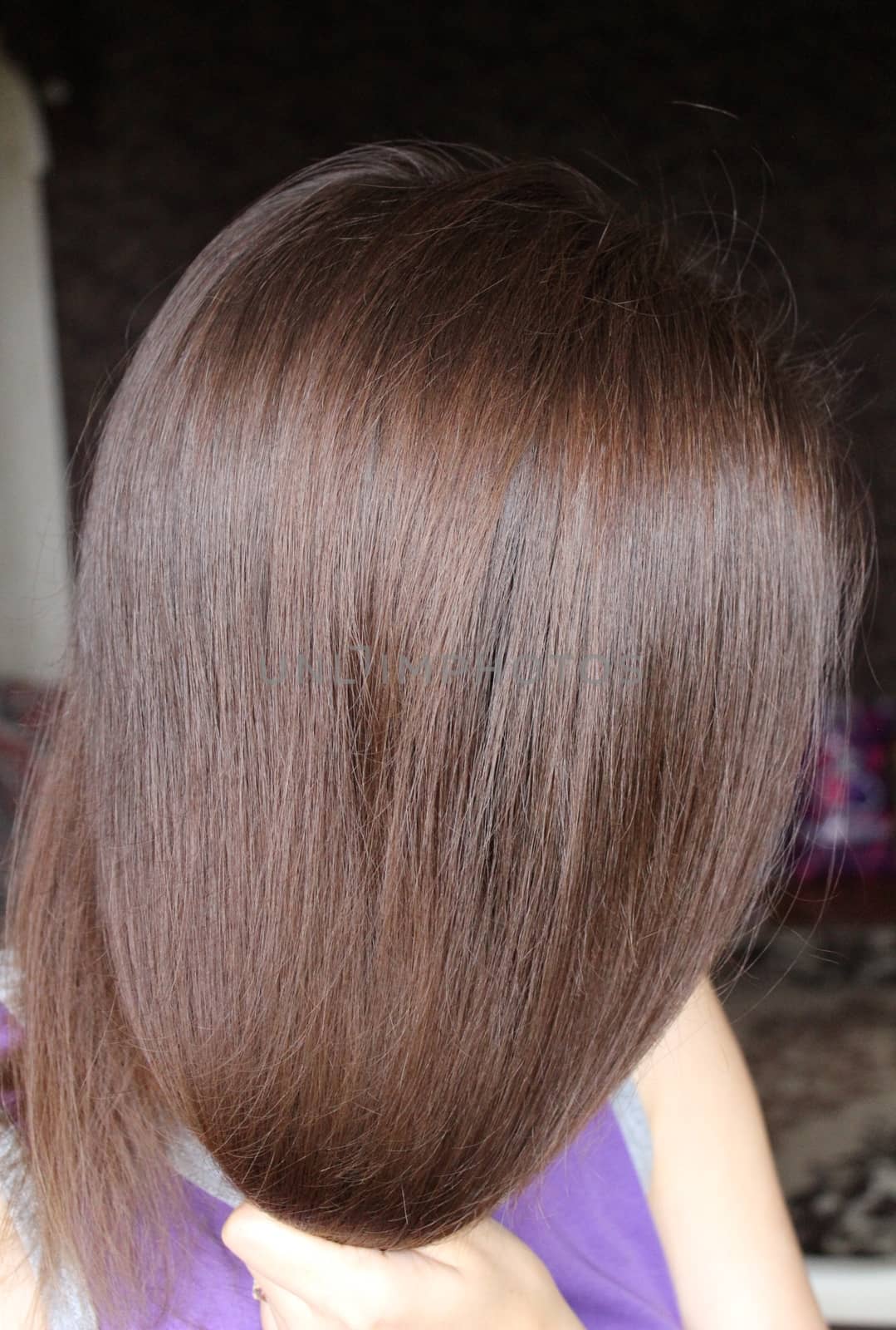 Women's hair is a top view close-up.