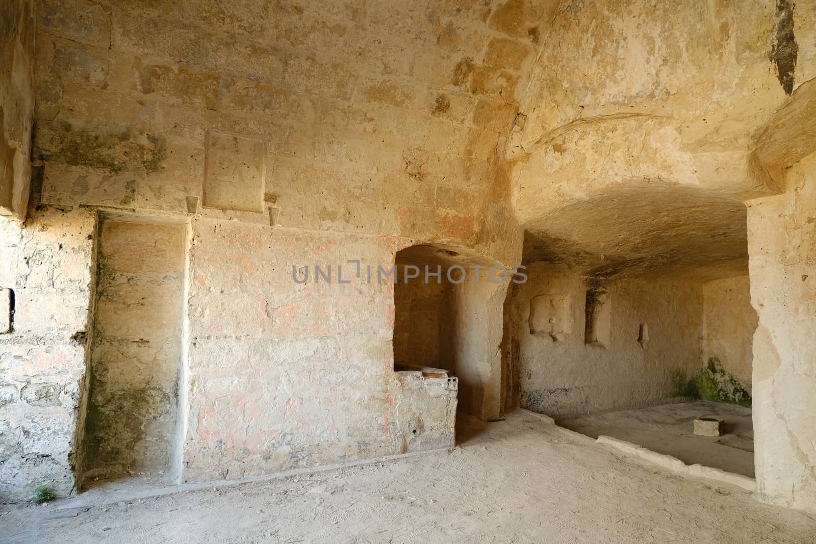 Sassi of Matera with arched ceilings and vaults. Ancient underground house dug out of the tufa rock.