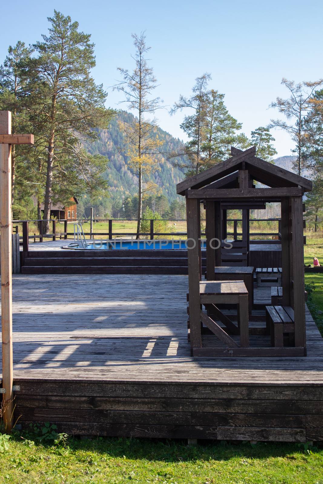 Wooden gazebo and outdoor swimming pool near the hotel by AnatoliiFoto