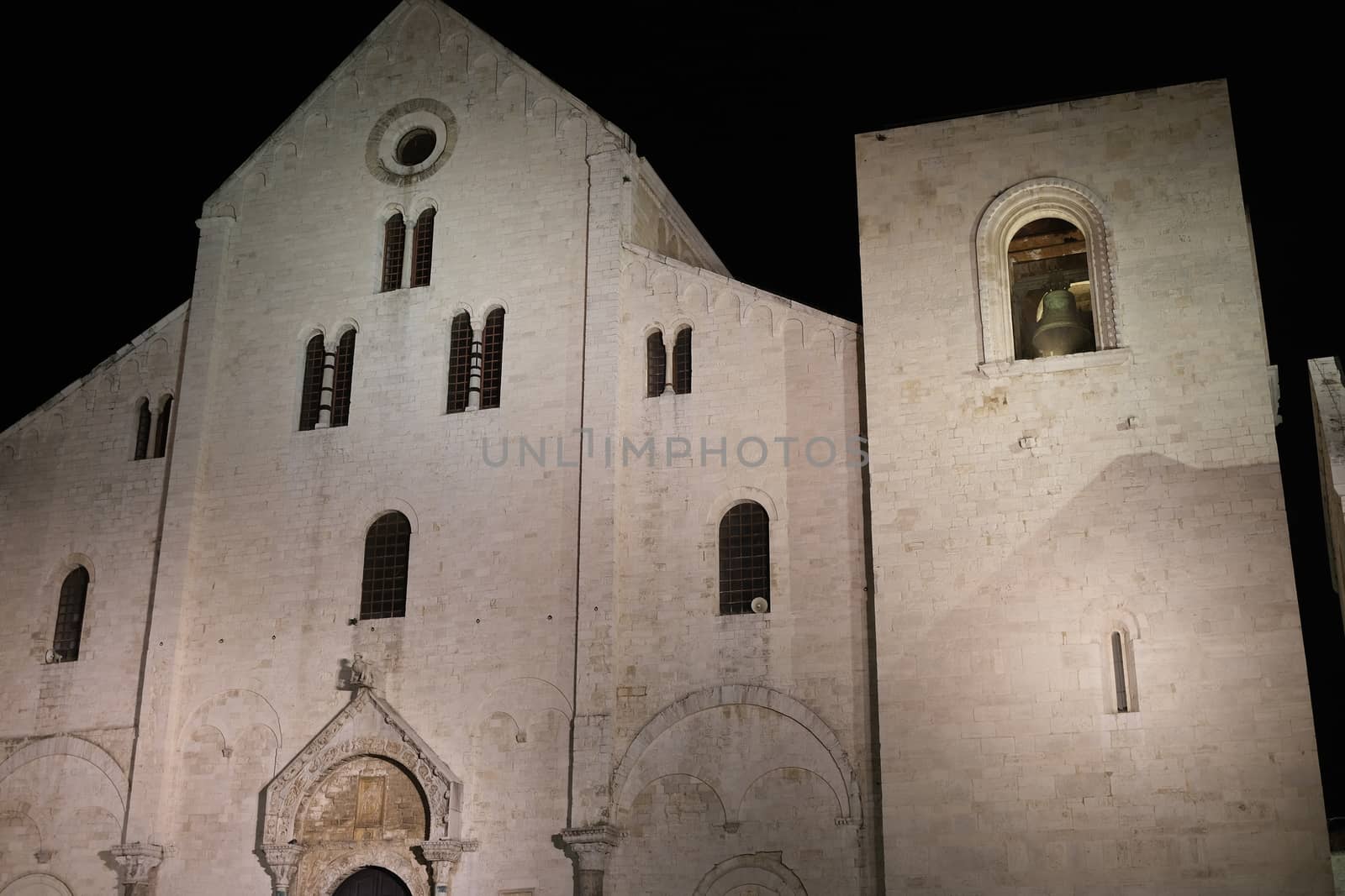 Façade of the church of San Nicola in Bari in limestone. Shooting with night light. Bari, Puglia, Italy.