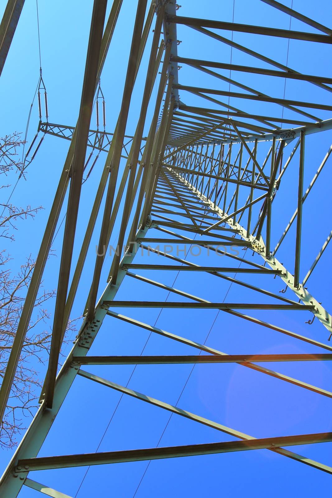 Close up view on a big power pylon transporting electricity in a by MP_foto71