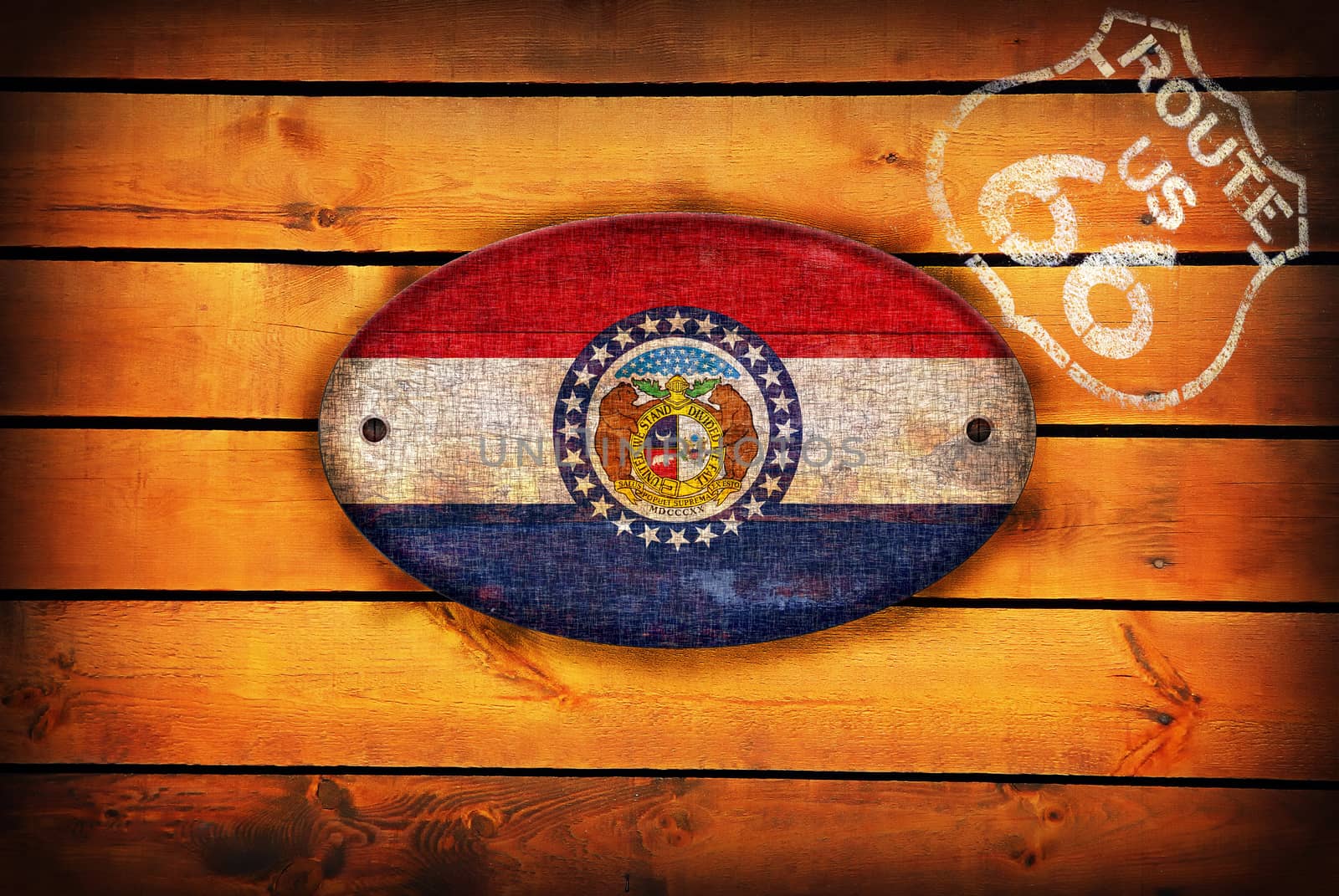 Brown wooden planks with the Missouri flag and shield of Route 66.