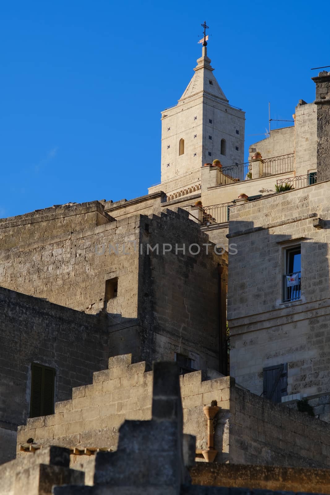 Houses and bell tower in the city of Matera in Italy. The tuff b by Paolo_Grassi