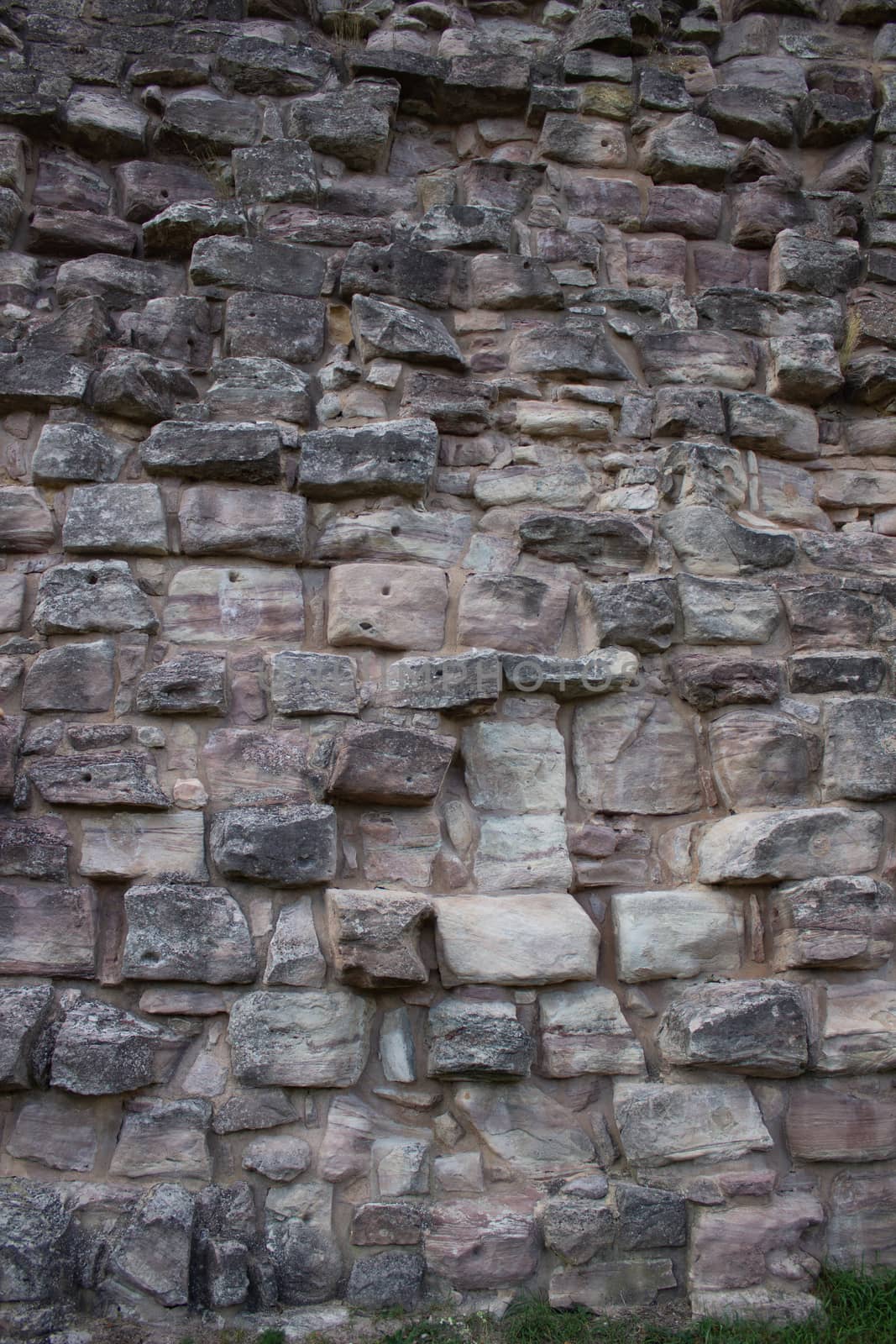 Texture of a stone wall. Old castle stone wall texture background. by AnatoliiFoto