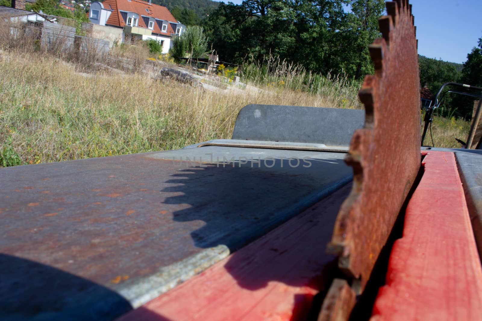 Round saw with teeth in the machine and its shadow by AnatoliiFoto