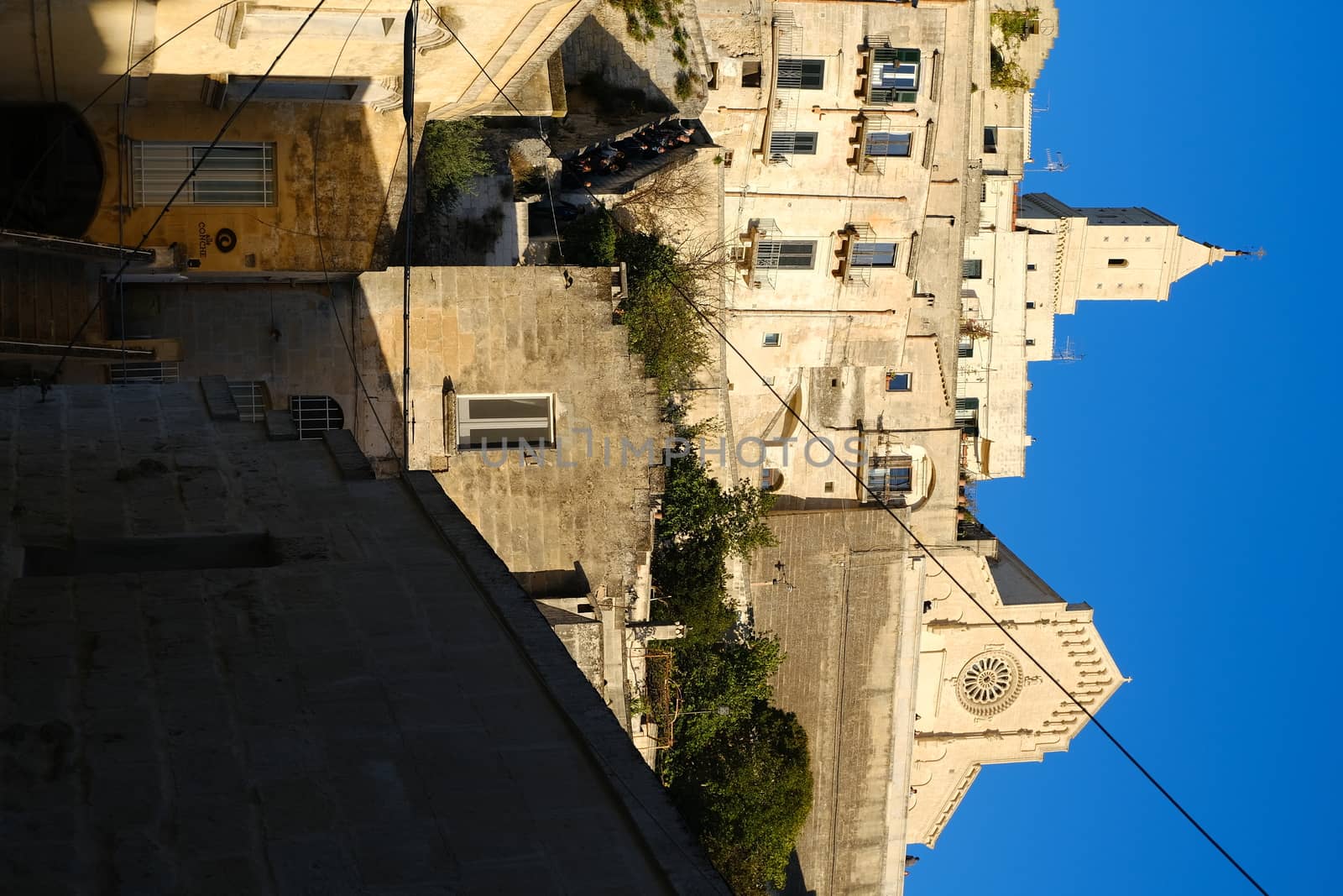 Matera, Basilicata, Italy. About 11/2019.  Houses, church and bell tower in the city of Matera in Italy. The tuff blocks are the material used for the construction of the houses.