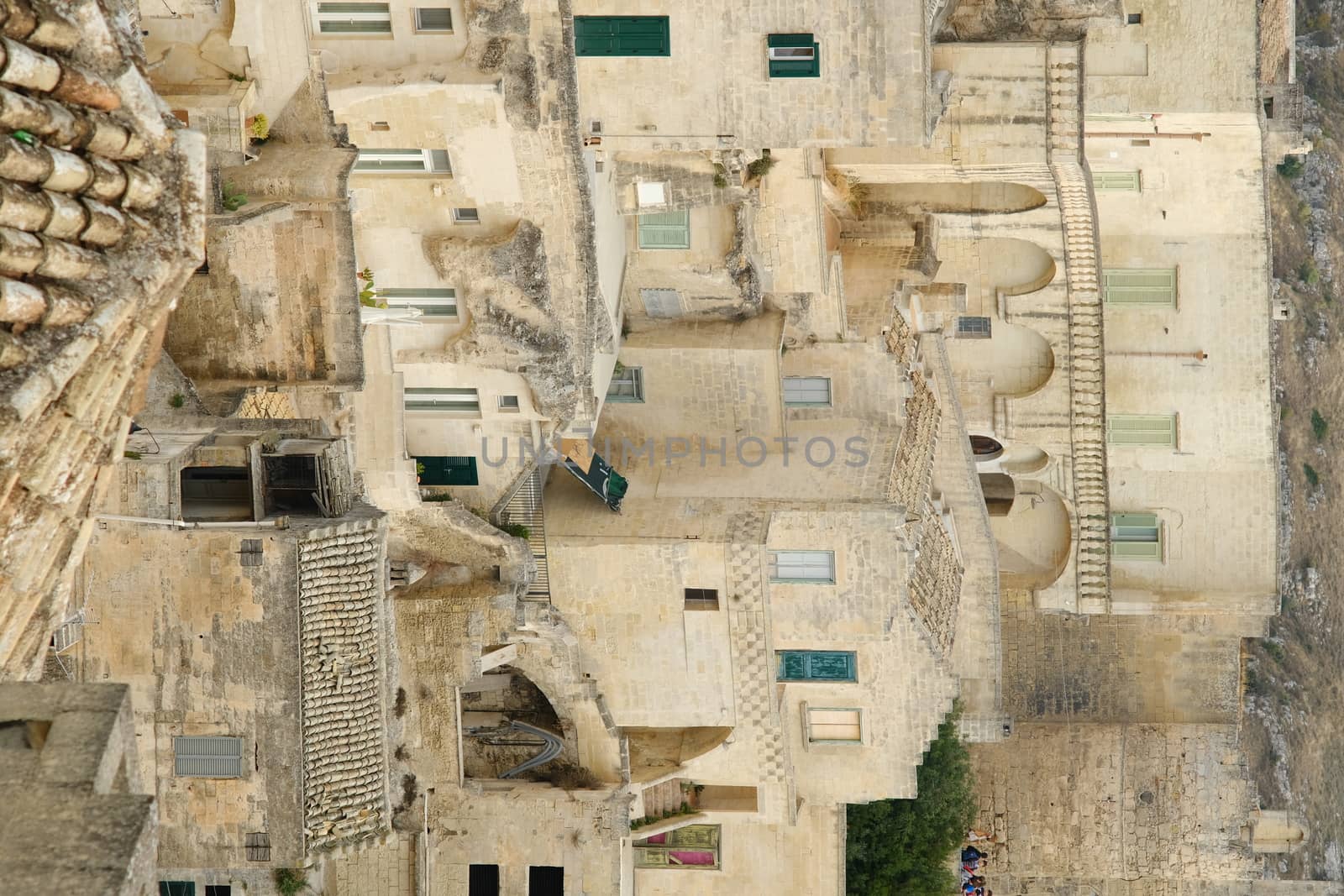 Matera, Basilicata, Italy. About/11/2019. Houses, roads and alleys in the Sassi of Matera. Typical dwellings carved into the rock and with facades of beige tuff blocks.