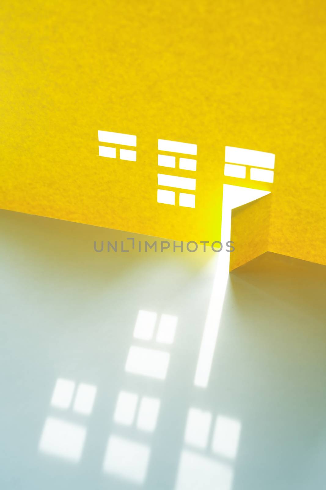 Composition cutting from paper. Yellow house with glowing windows and open door