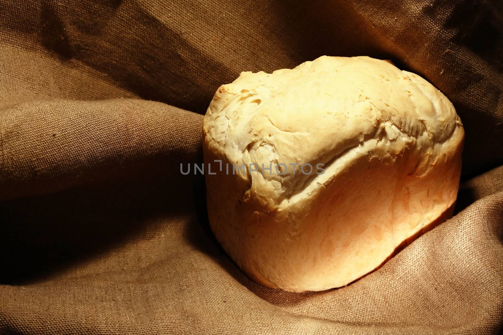 Freshness loaf of white bread on canvas background