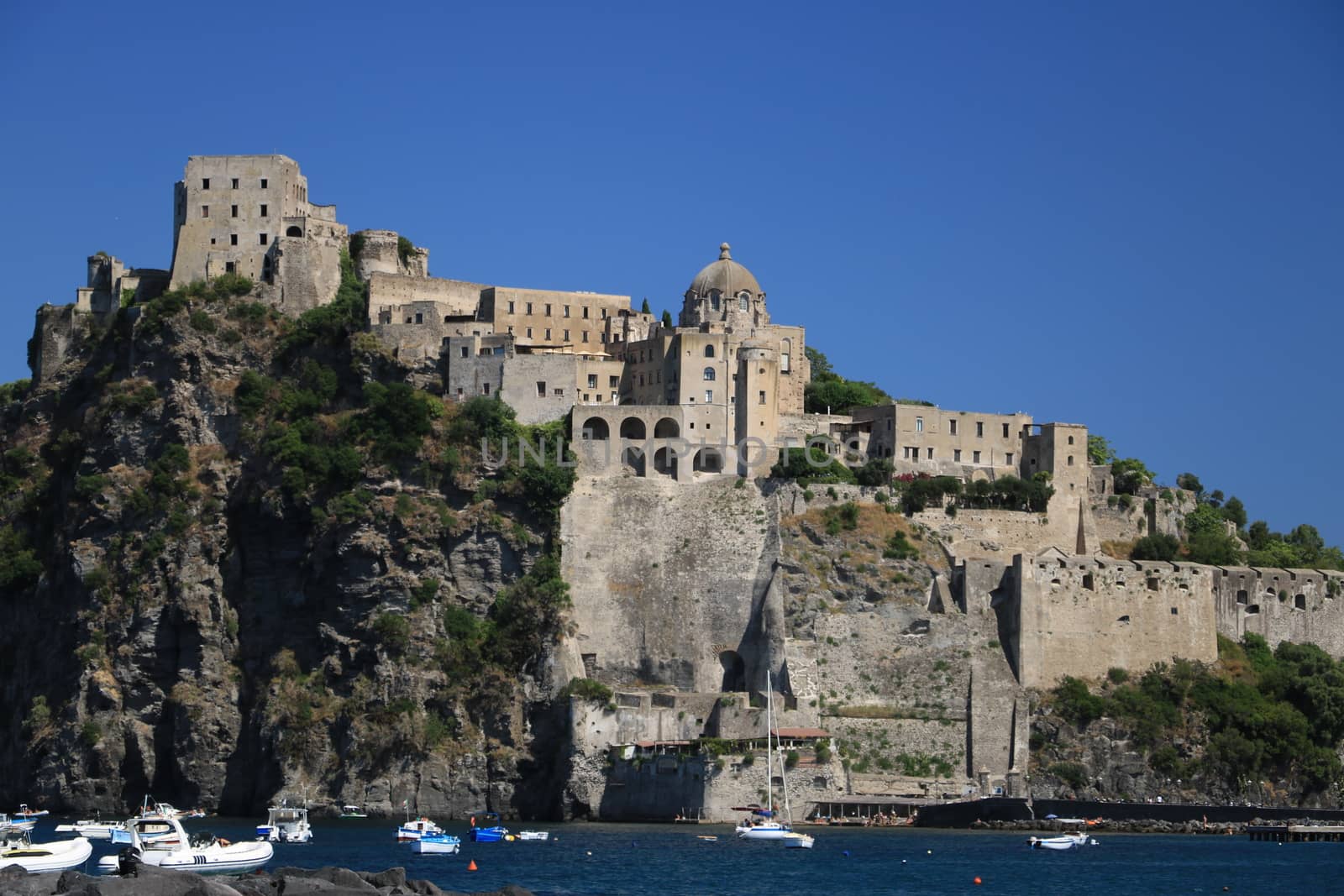 Ancient Aragonese Castle in Ischia Ponte. The fortification stands on a peninsula of volcanic rock connected to the village of Ponte. Ischia, Naples, Italy. 