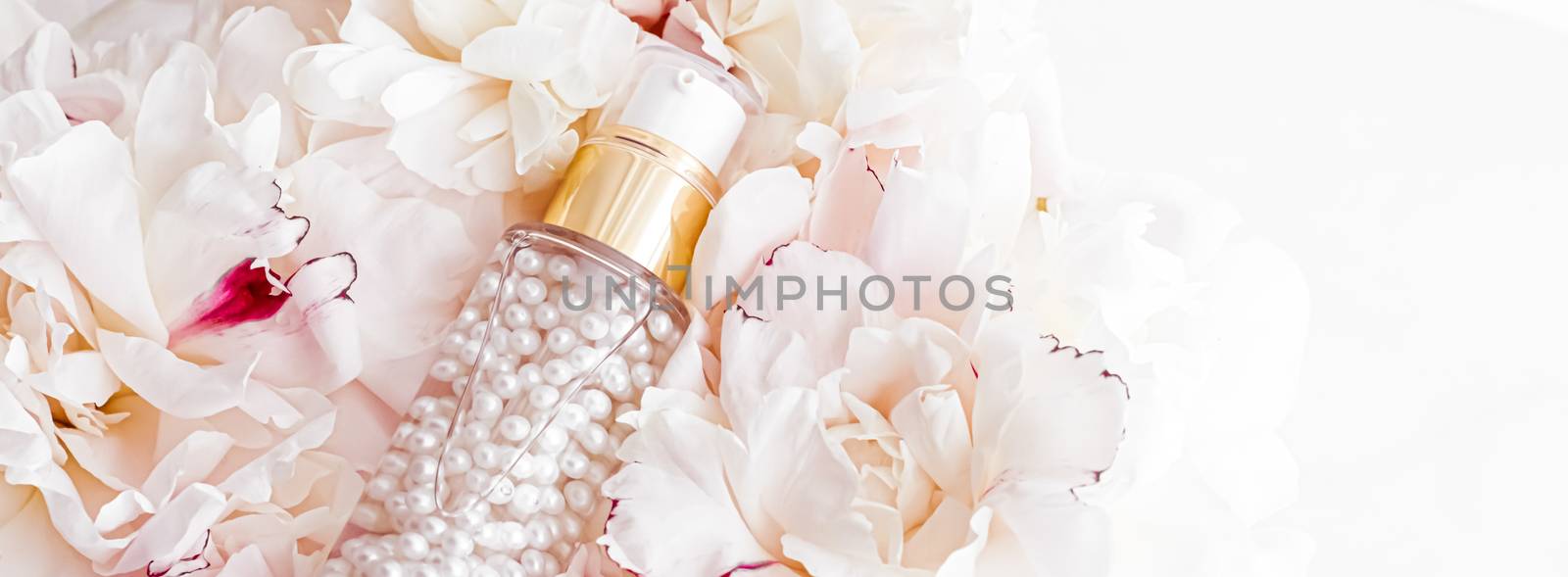 Luxurious cosmetic bottle as antiaging skincare product on background of flowers, blank label packaging for body care branding by Anneleven