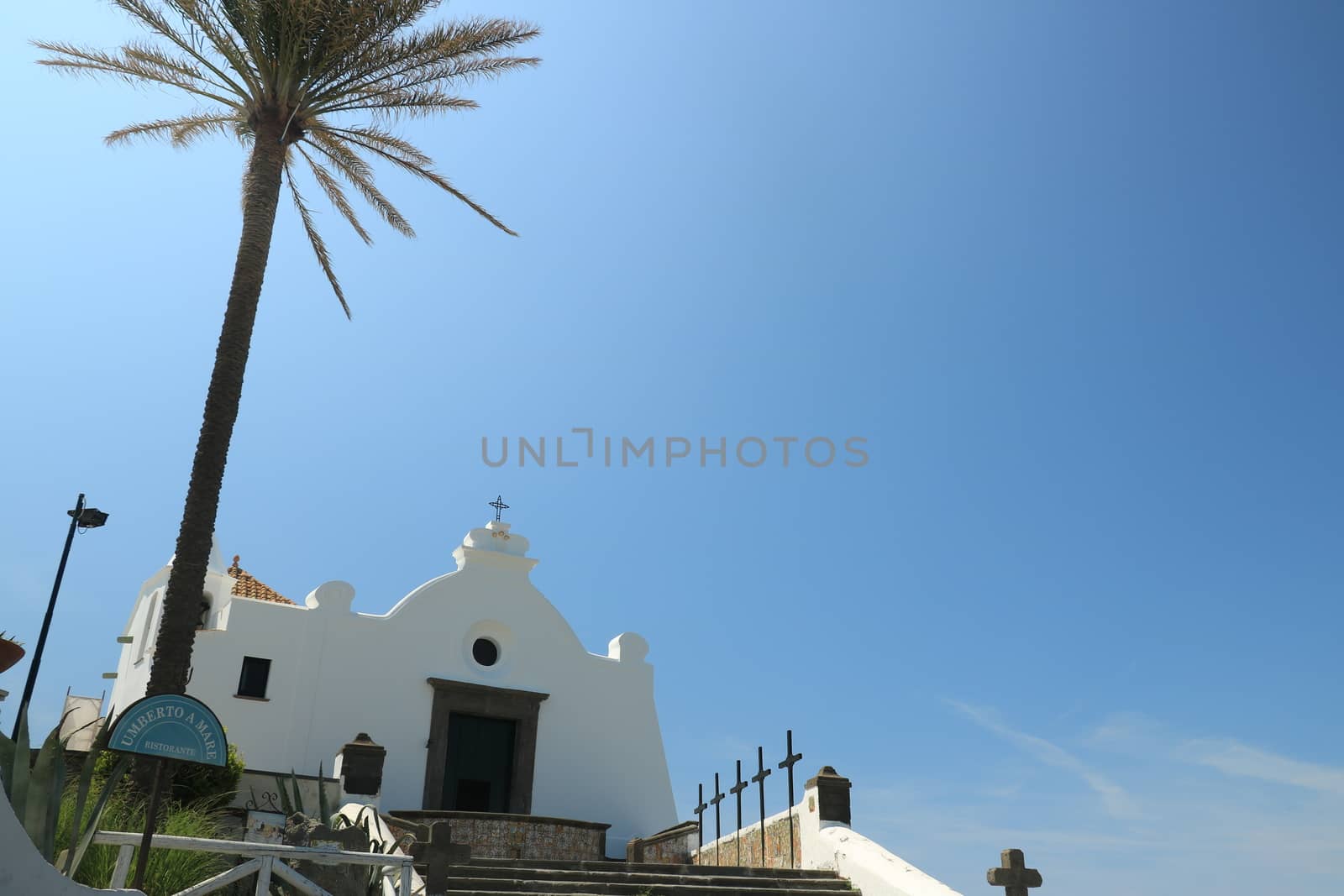 Church of Soccorso in Forio on the island of Ischia near Naples. Example of typical Mediterranean architecture rises above the sea.