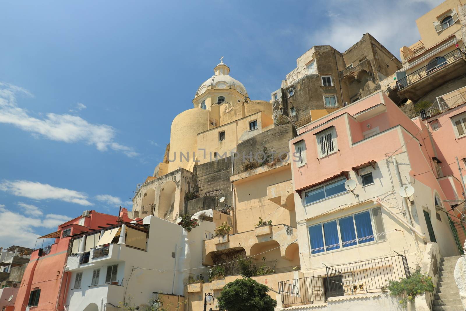 Procida island, Naples, Italy, About the July 2019. Village of Marina Corricella, Procida Island, Mediterranean Sea, near Naples. Colorful houses in the fishing village and boats anchored in the harbor.