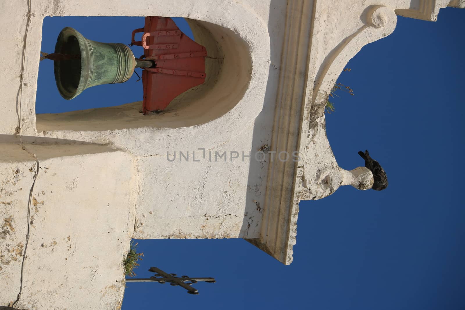 Bell tower with bells in a Mediterranean church on the island of Procida.