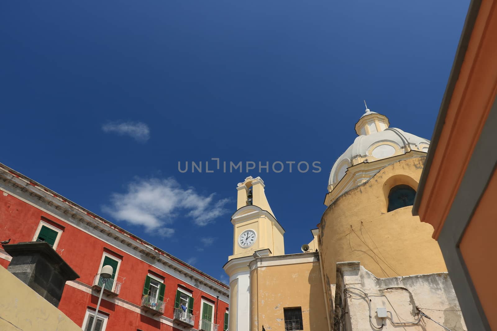 Church with bell tower and buildings in the square on the Island by Paolo_Grassi