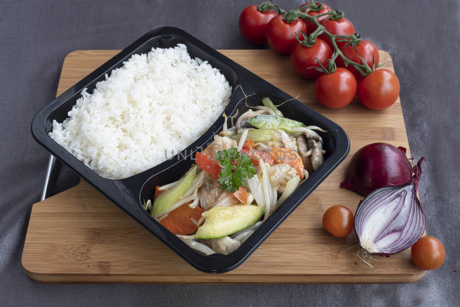 Stir fried chicken served with several type of vegetables as side dish for Chinese meals