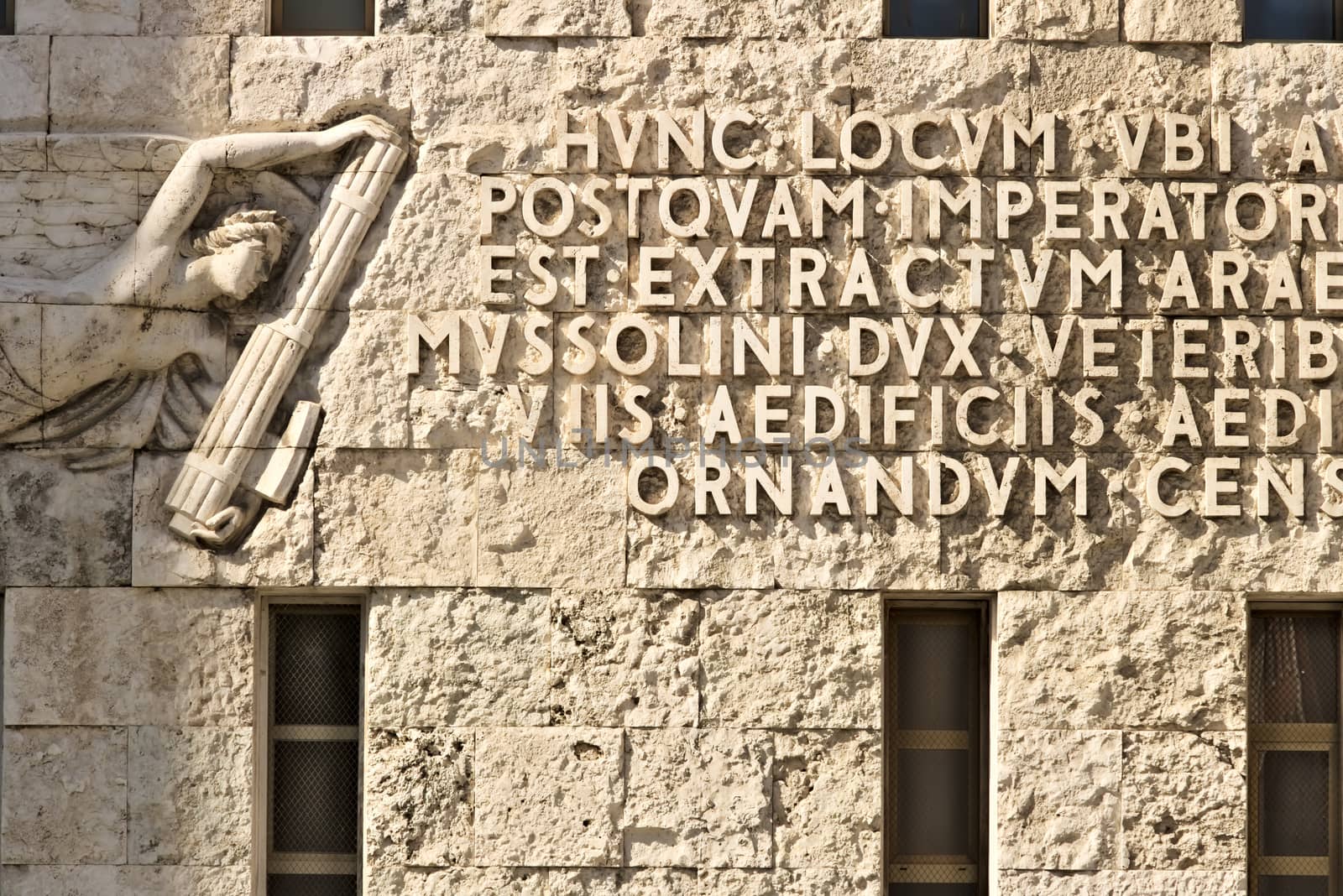 Written from the fascist era engraved on stone in the facade of the building. Rome Italy. 05/02/2019. 