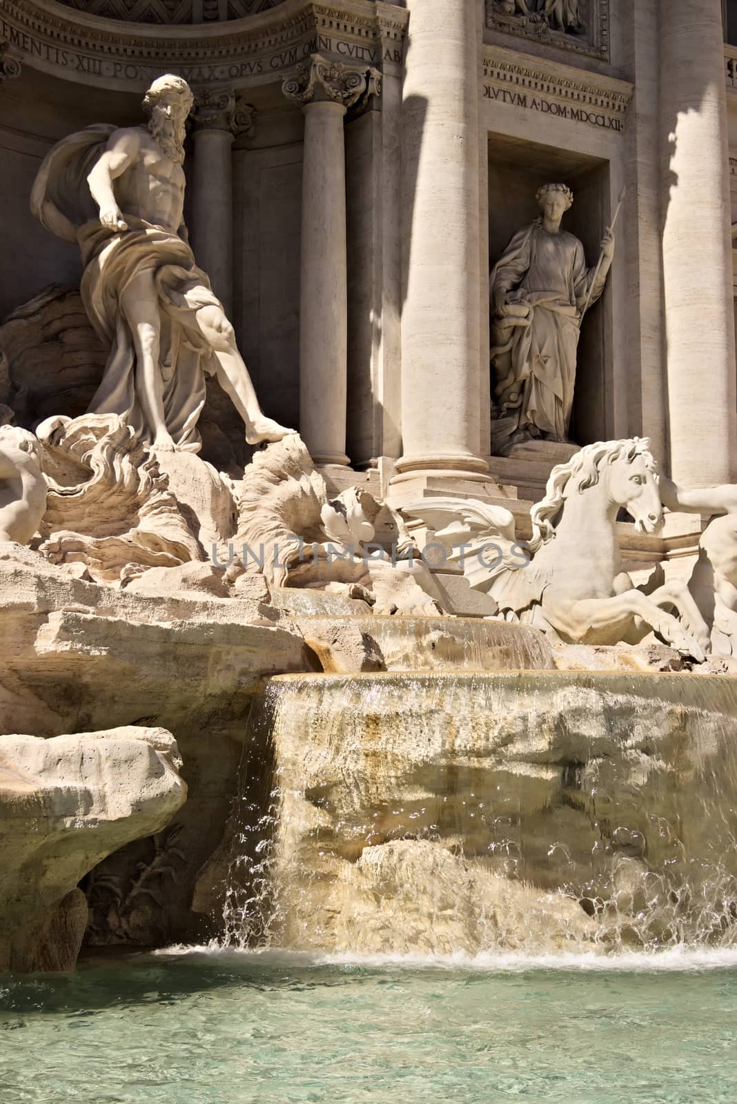 Trevi Fountain in Rome with the sculpture of Neptune. Rome Italy. 05/02/2019. The complex of the fountain built in the Baroque period is built in travertine marble.