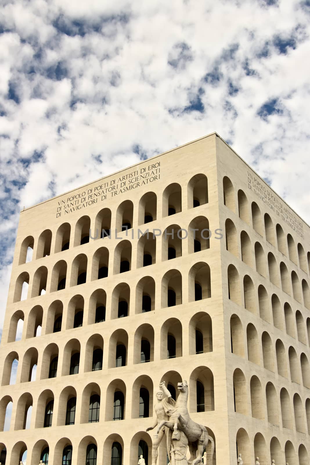 Palace of Italian Civilization built in Rome. Fendi exhibition. Rome Eur, Italy. 05/03/2019. Entirely covered in travertine marble, inspired by the arches of the colosseum. Facade with blue sky background.