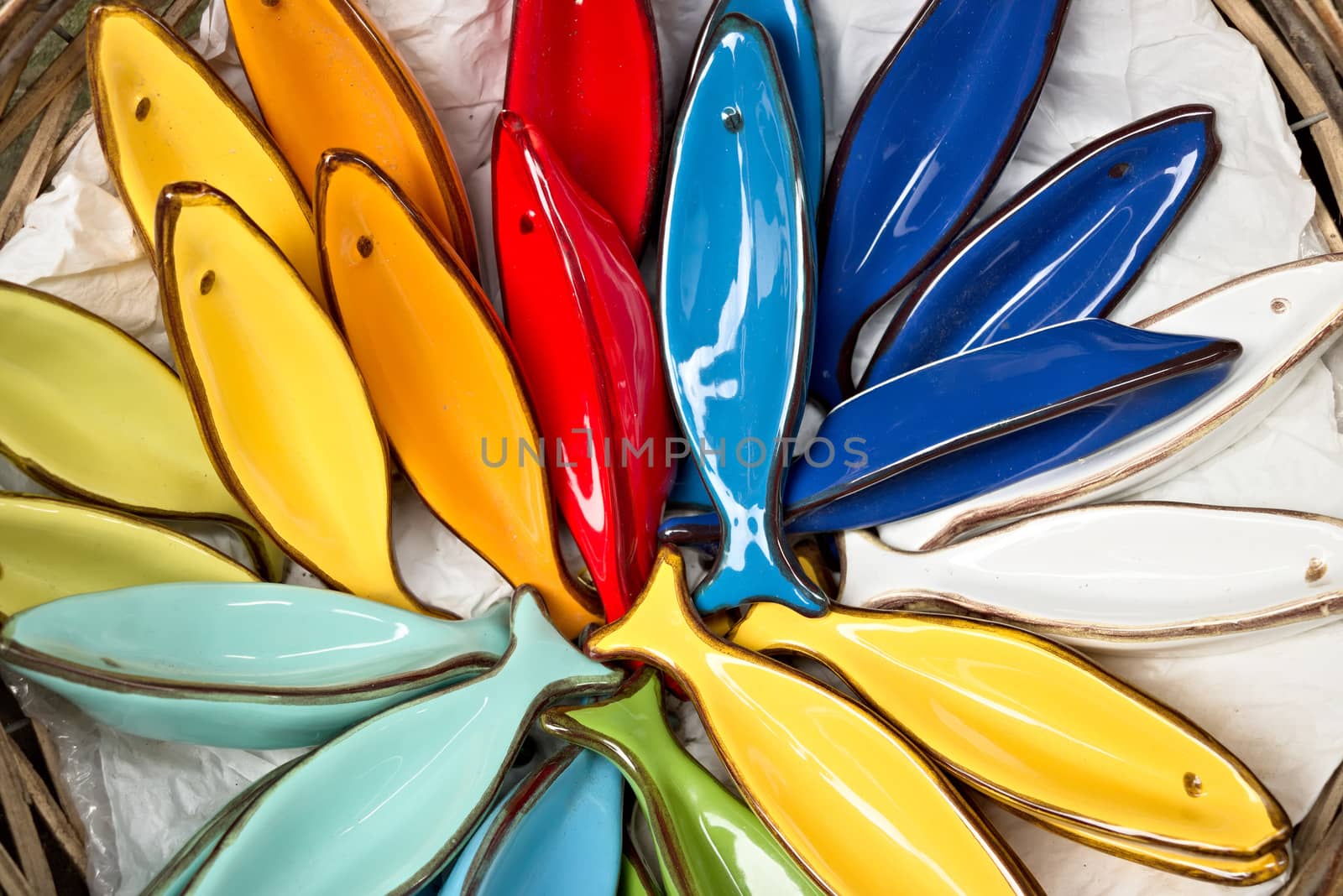 Handmade ceramic decorations representing colorful fish.