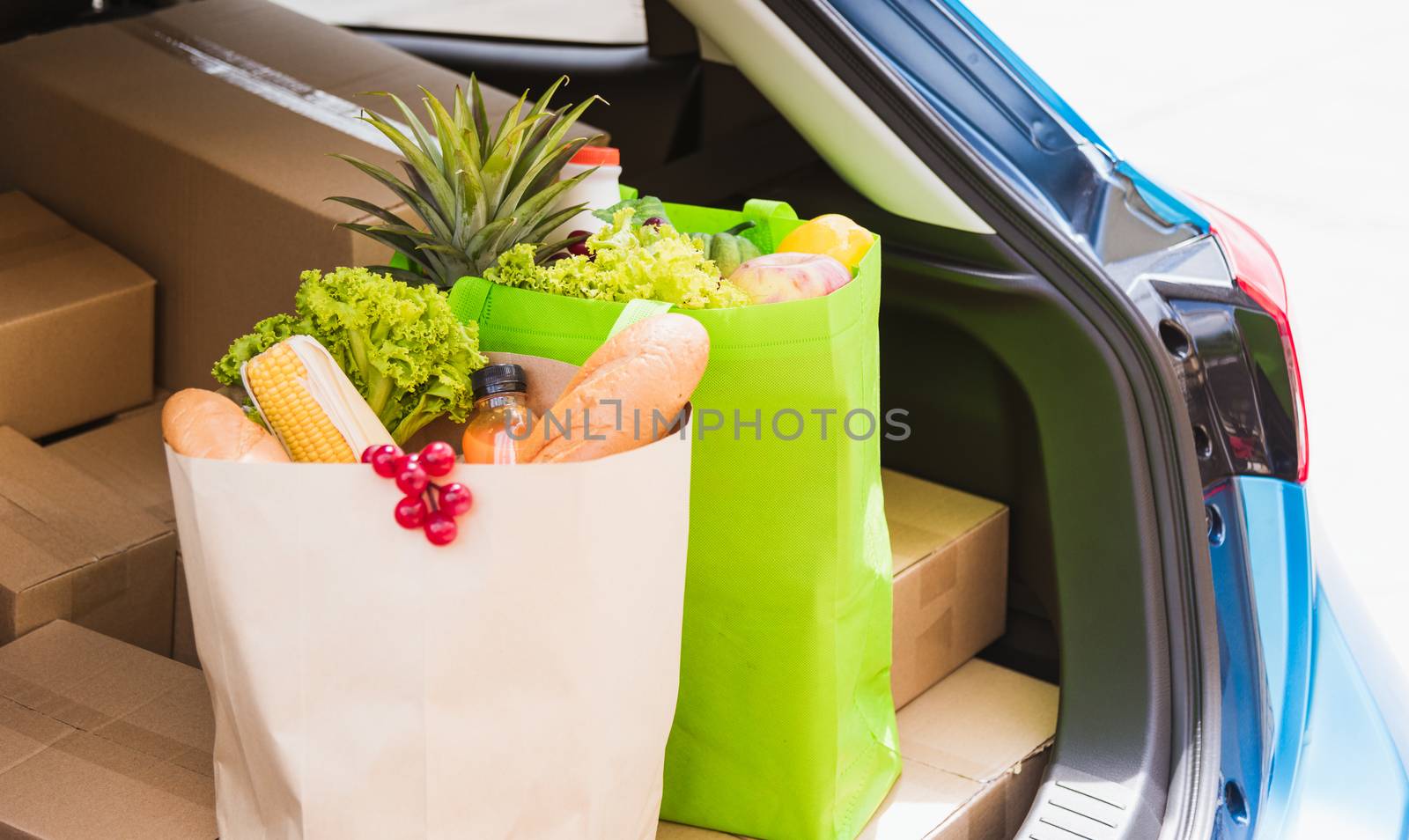 Grocery service giving fresh vegetables and fruits and food in green cloth bag and wooden basket on the back car ready delivery to send woman customer