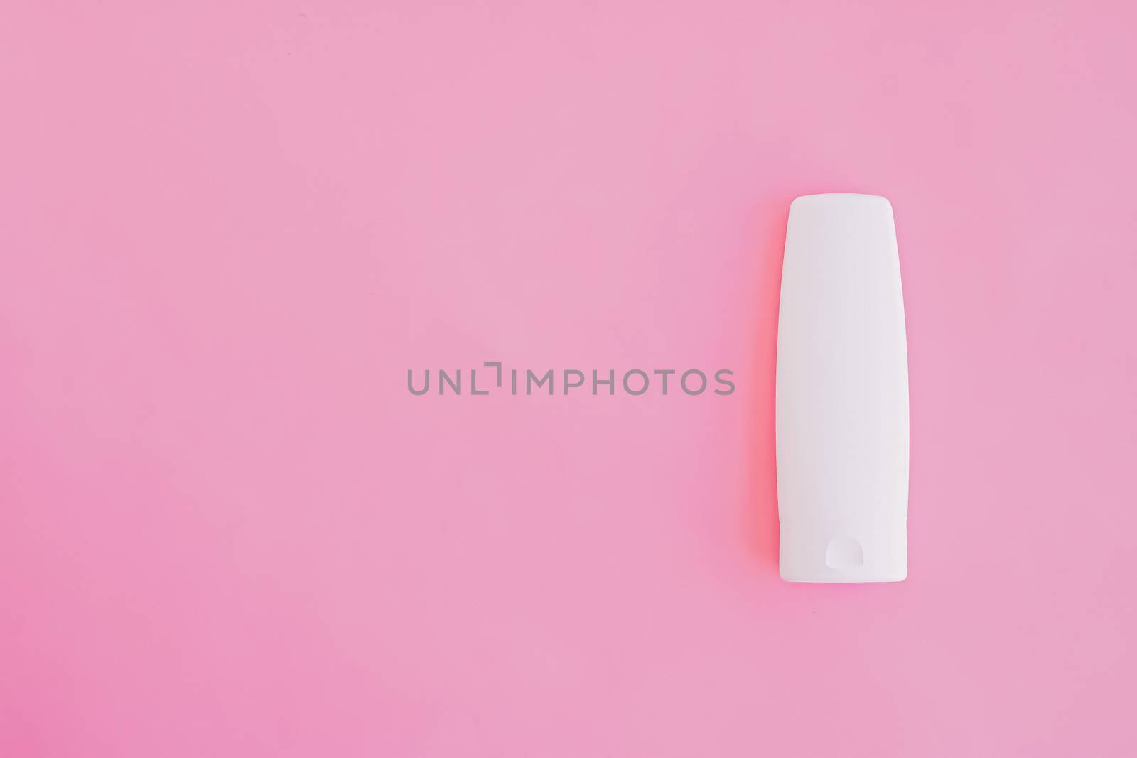 Moisturizing hand cream or body lotion on pink background, beauty product and skin care cosmetics, flatlay