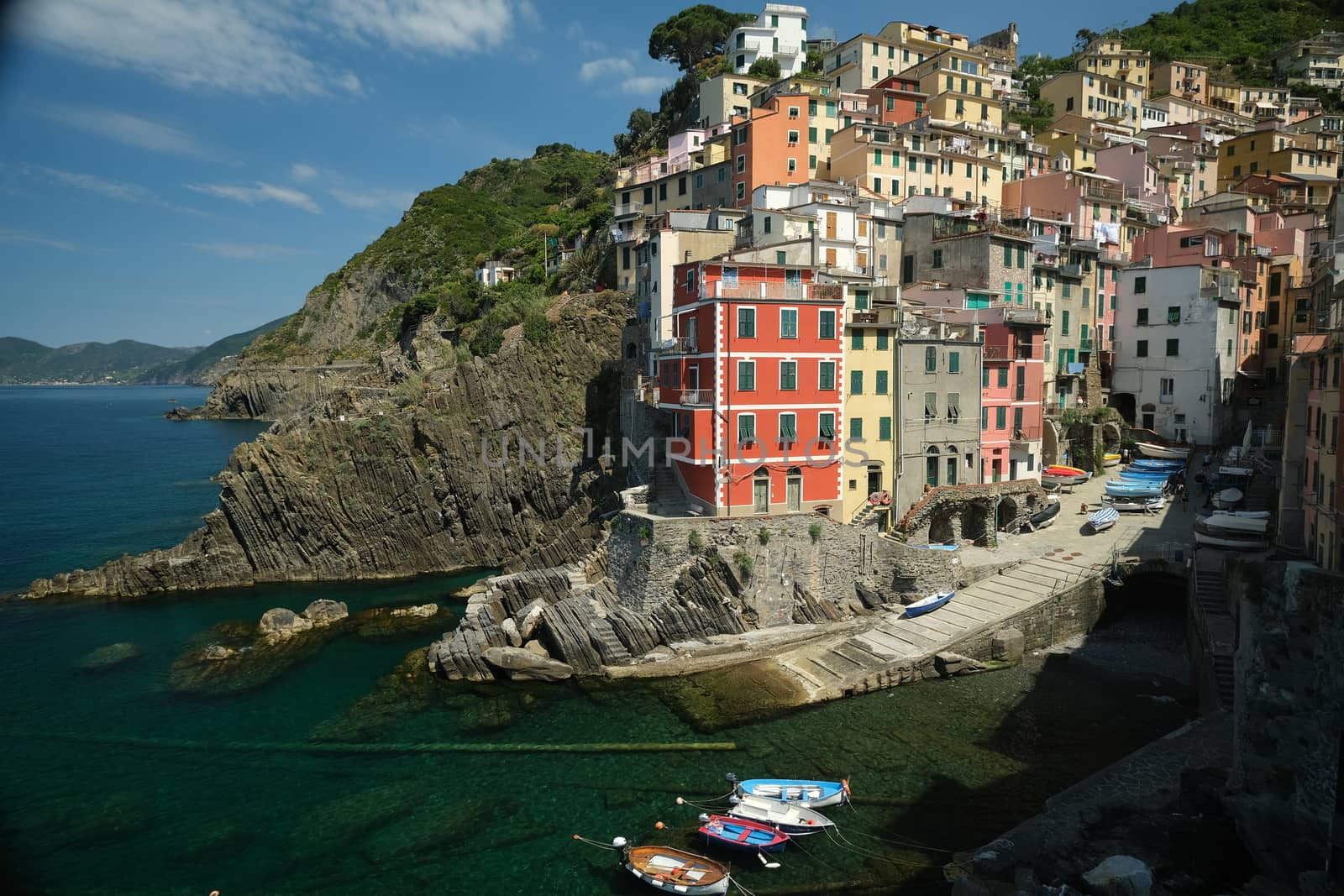 Riomaggiore to the Cinque Terre. Colored houses on the sea. Famous tourist destination. Coronavirus period. Royalty Free Stock Photos.