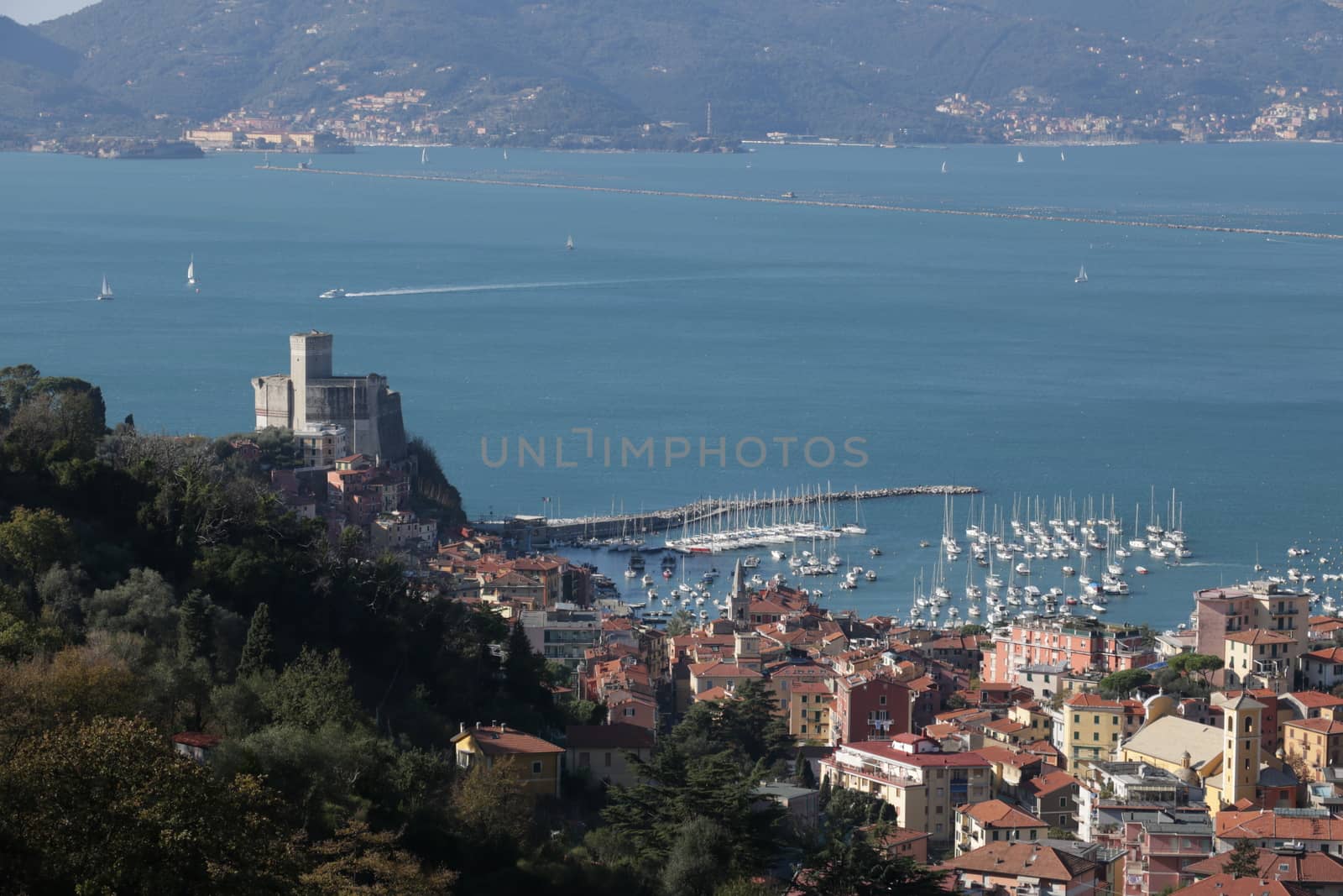 Panorama of the town of Lerici with the sea, the castle, the houses and the tourist port.