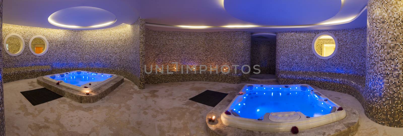Panoramic view of wet area in a luxury health spa with two large jacuzzi