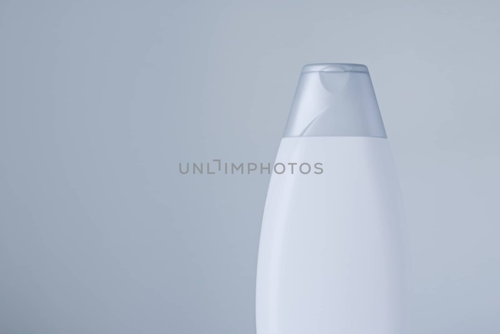 Blank label cosmetic container bottle as product mockup on gray background, hygiene and healthcare