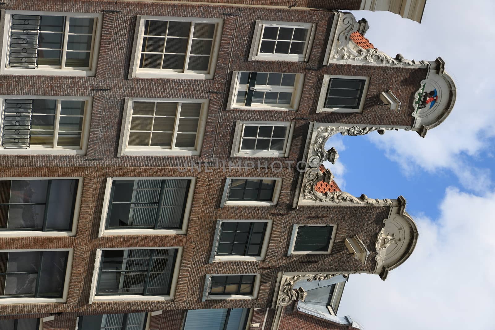 Amsterdam, Netherlands. Detail of facades of typical buildings with hooks for lifting goods in warehouses.