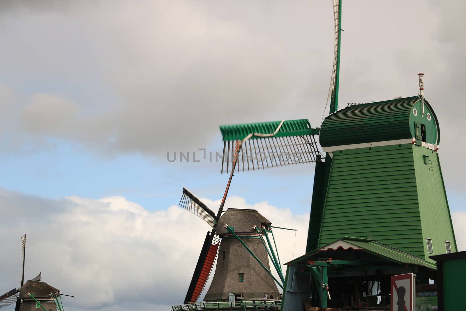 Amsterdam, Netherlands. About the July 2019.  Windmills of Zaanse Schans, near Amsterdam. The structures were used in the past to grind the cocoa beans used in nearby factories and to cut timber.