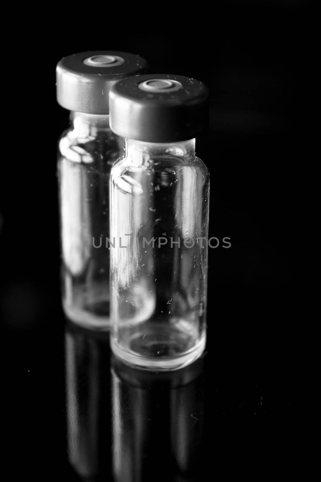 Vaccine vials against virus by GemaIbarra