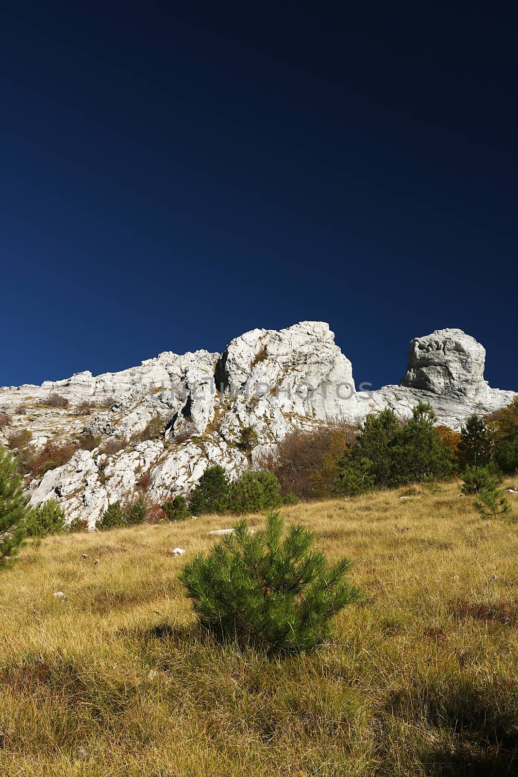 Details of mountains with a particular shape with a dark blue sky background.