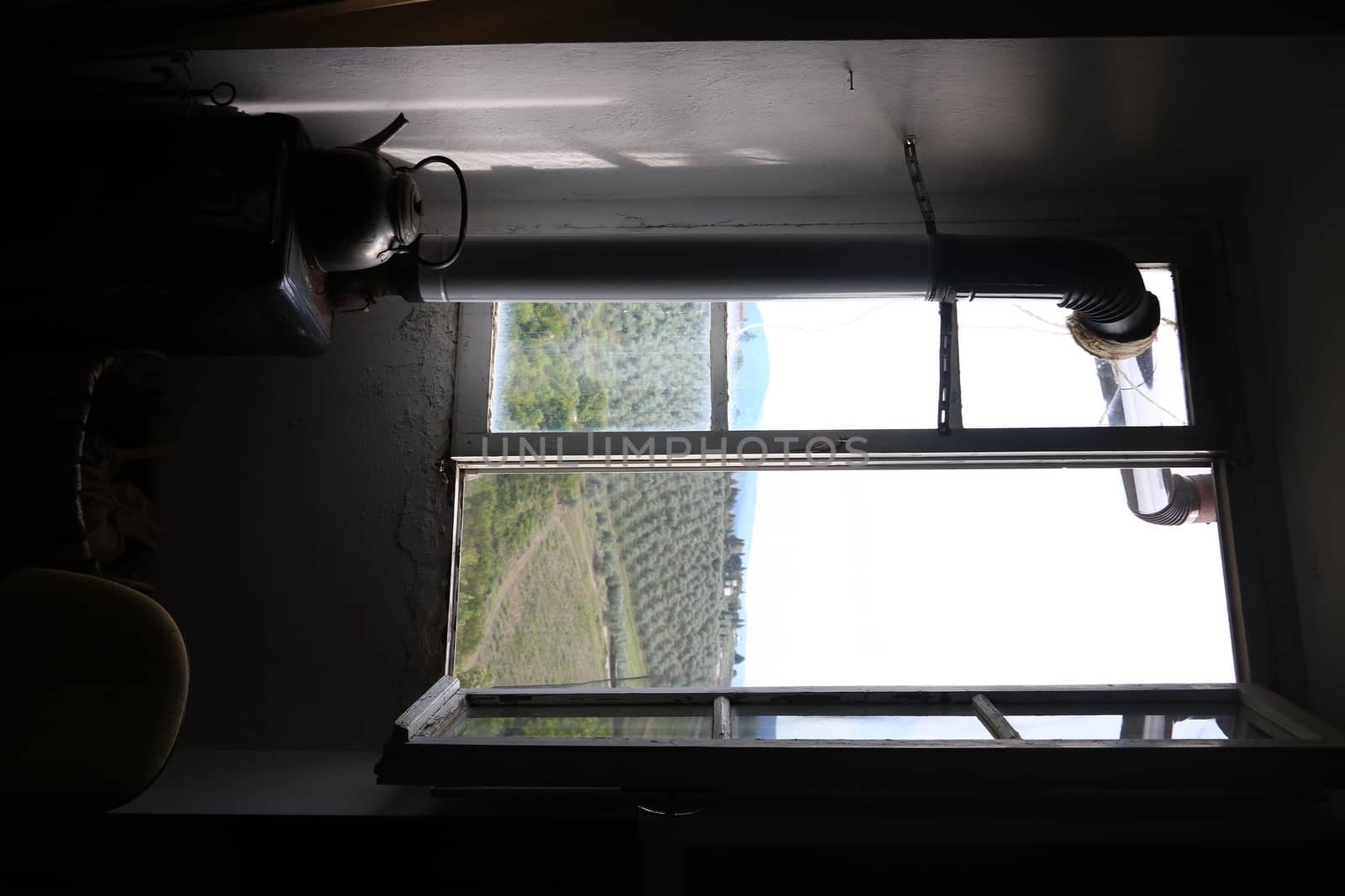 Old artist's studio window with the backdrop of the hills of Flo by Paolo_Grassi