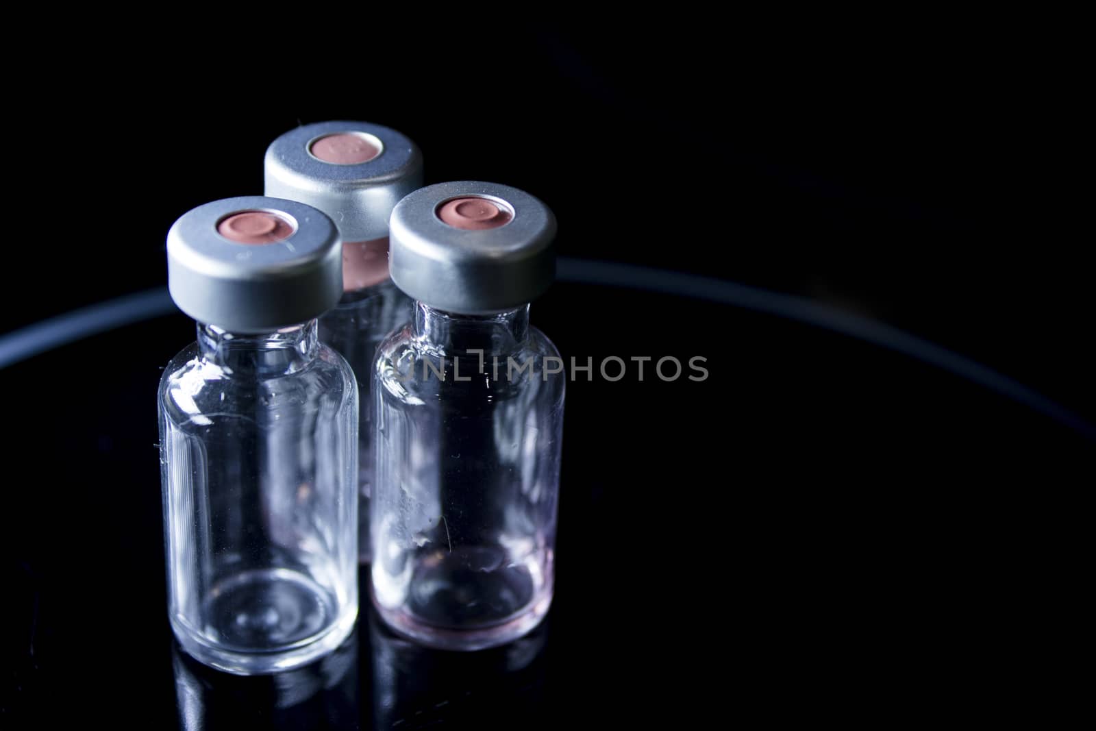 Vaccine vials against virus by GemaIbarra