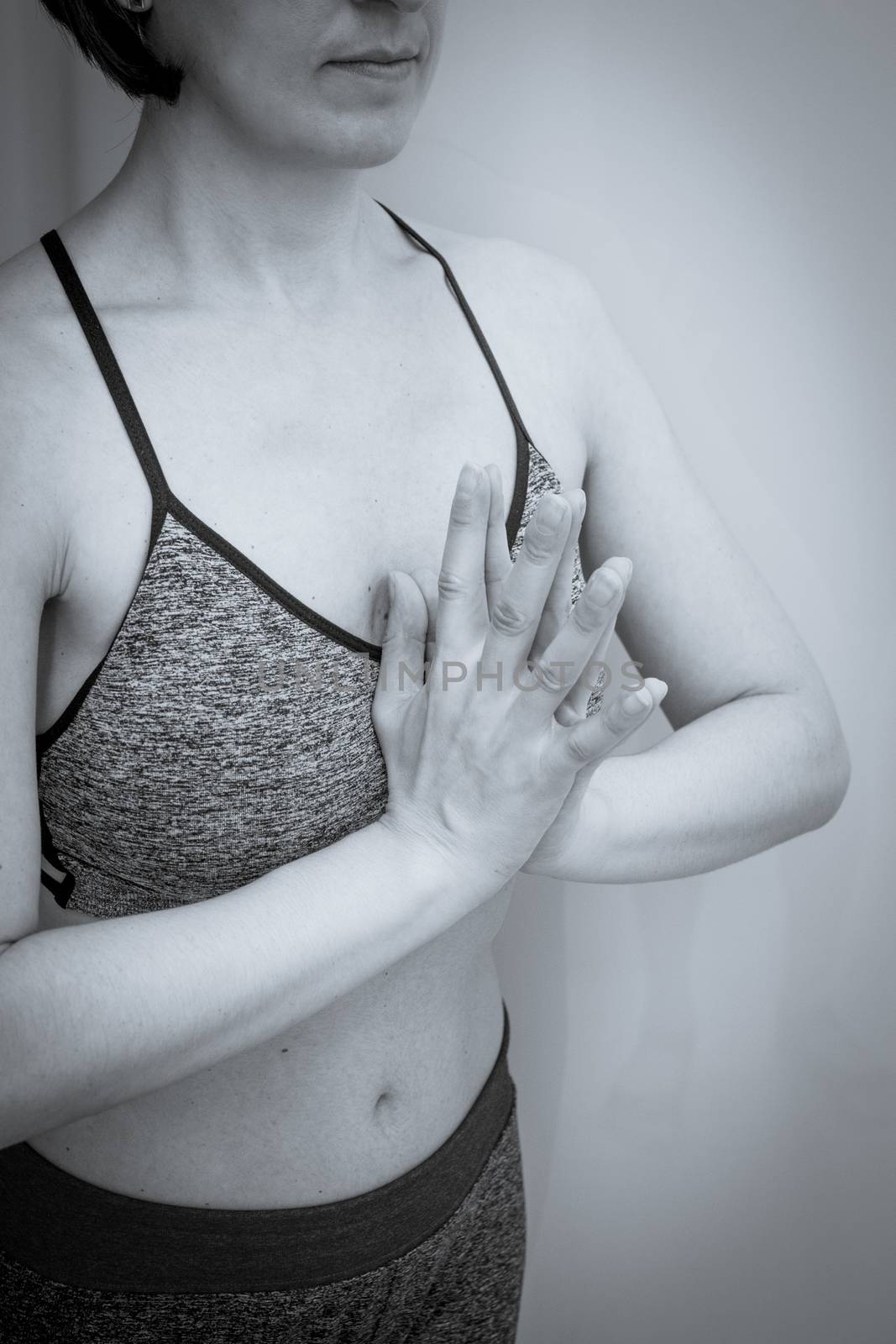 Womans hands practicing yoga and meditation positions by GemaIbarra