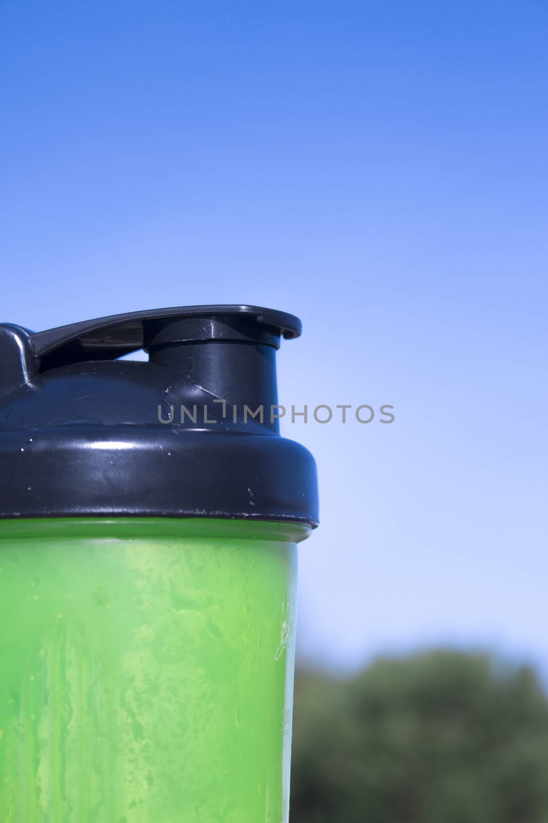 Transparent yellow shaker for sports drinks