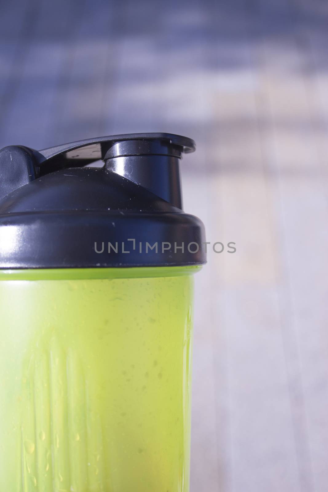 Transparent yellow shaker for sports drinks