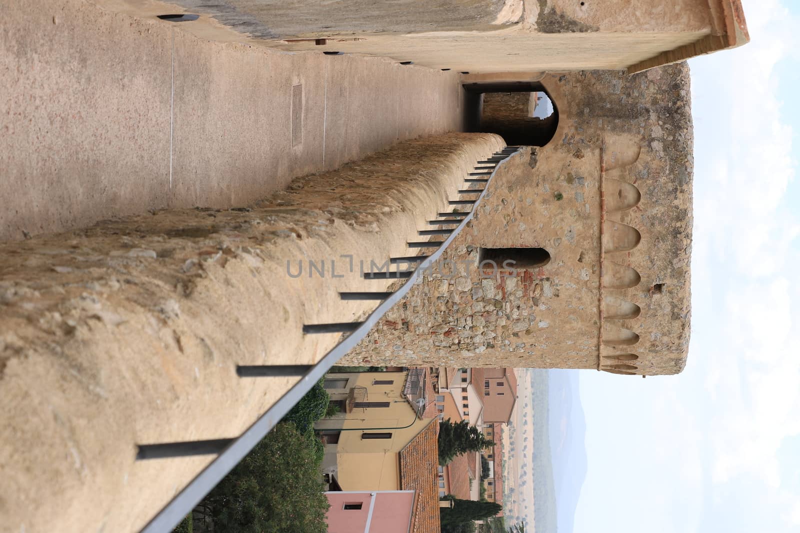 Walls of the town of Magliano in Tuscany. Maremma. 	Path on the castle walls. Landscape with countryside of the hills.
 by Paolo_Grassi