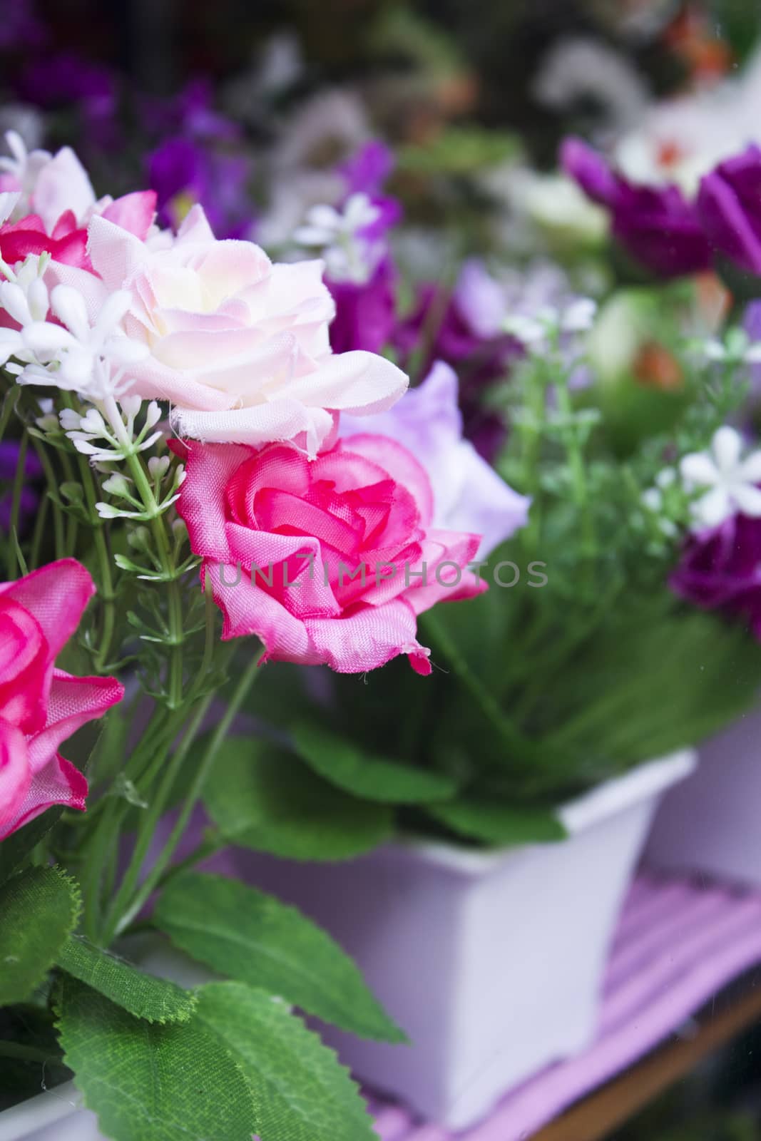 Artificial fabric flowers. Multicolored