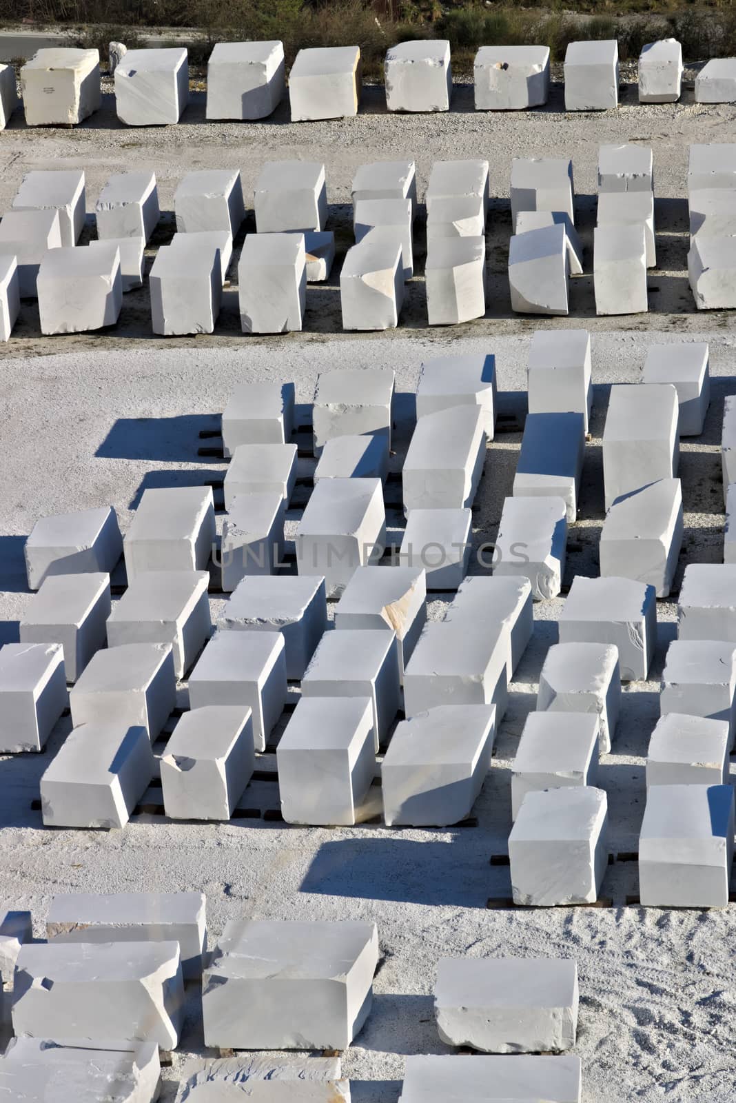 The blocks of white Carrara marble, after being extracted from the quarry, are deposited in outdoor squares, not far from the extraction sites.