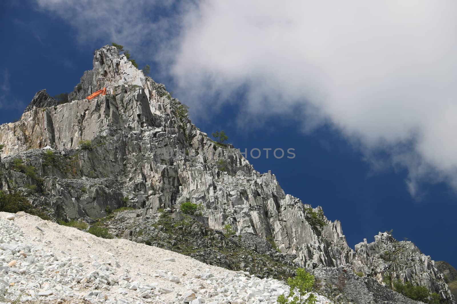 White Carrara marble quarry in the Apuan Alps. A mountain peak n by Paolo_Grassi