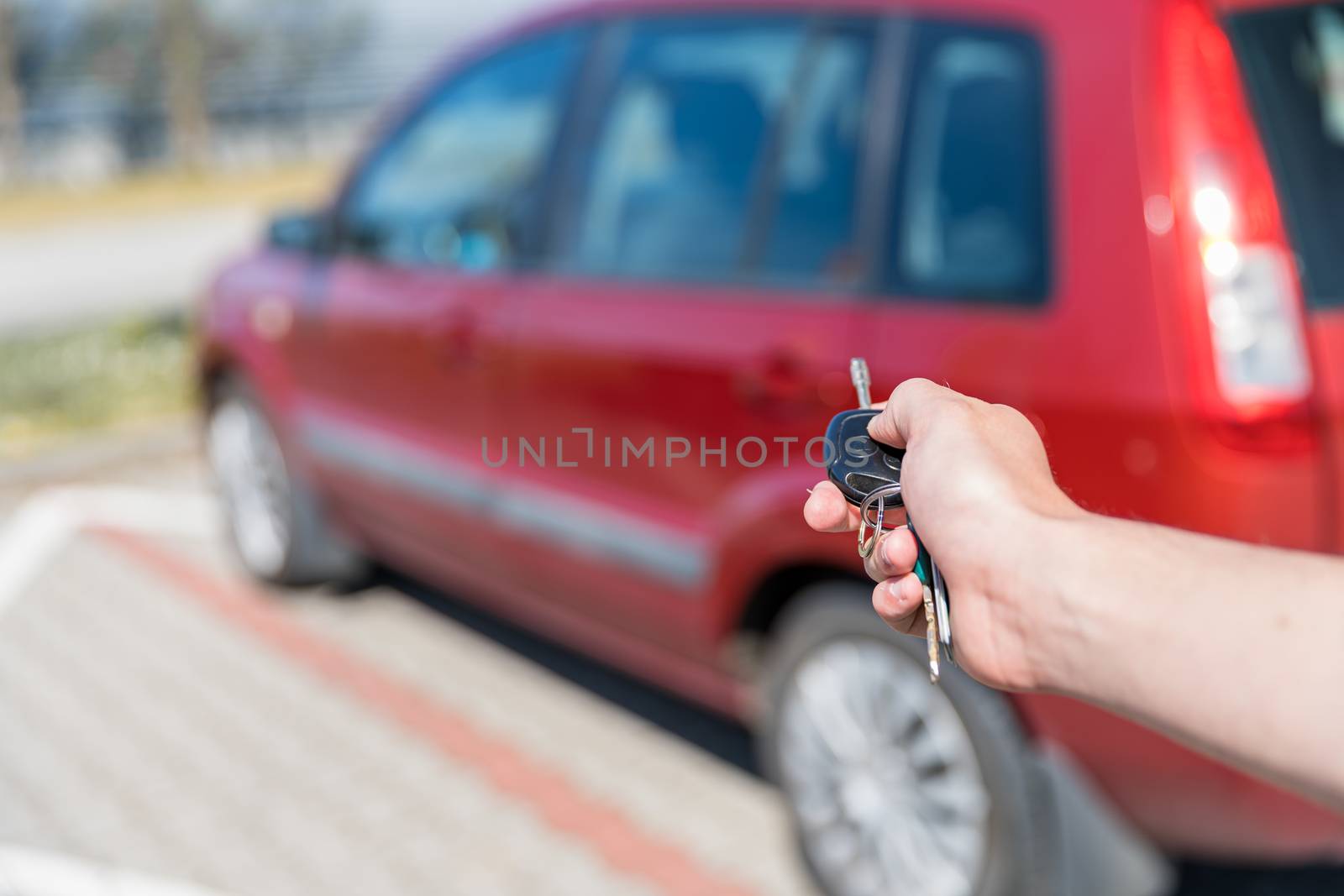 Unlocking a car trunk by remote control.