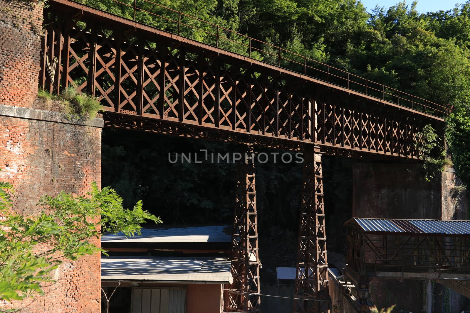 Iron bridge with reticular structure. The bridge was part of the ancient Carrara marble railway.