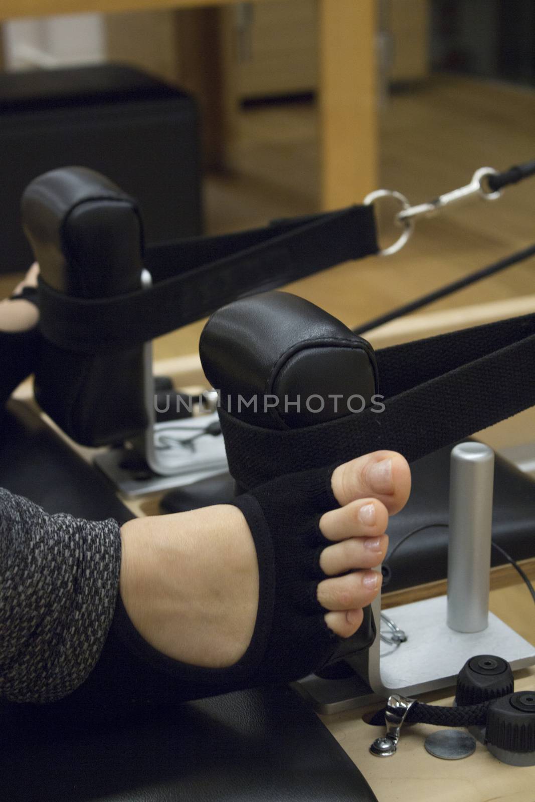 Woman doing pilates machine exercises