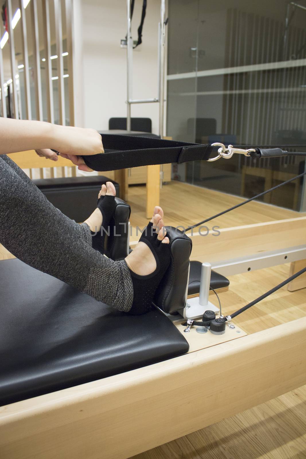 Woman doing pilates machine exercises